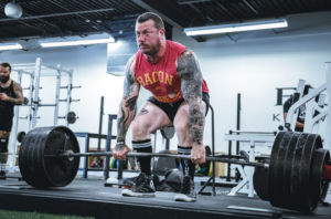 man lifting heavy weights